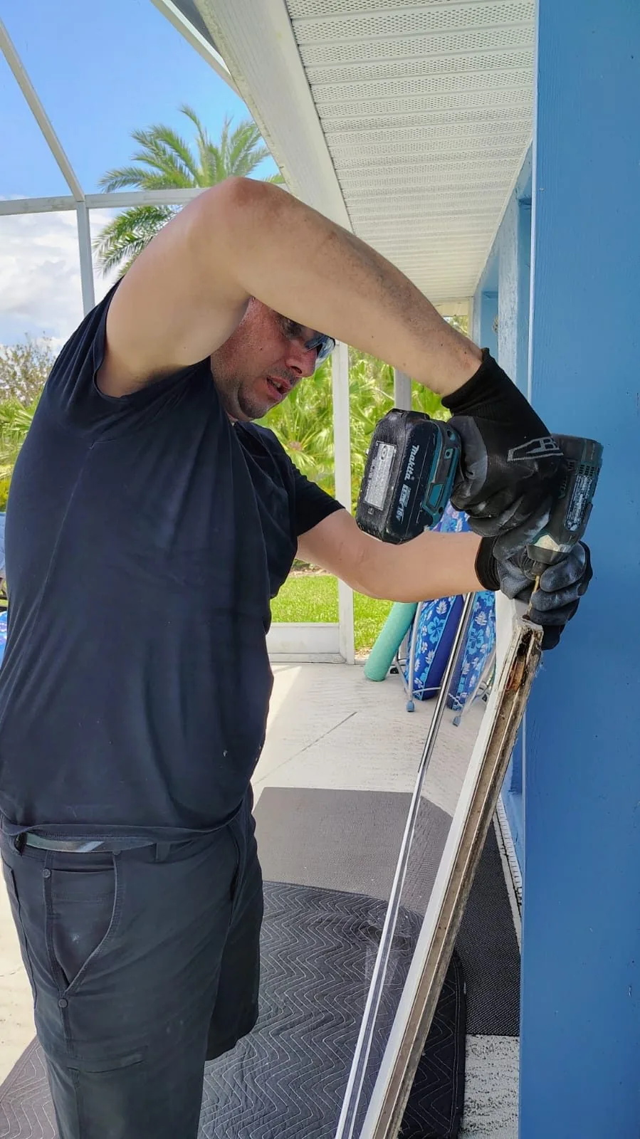 KayGE technician reinforcing a sliding door frame on a Florida home
