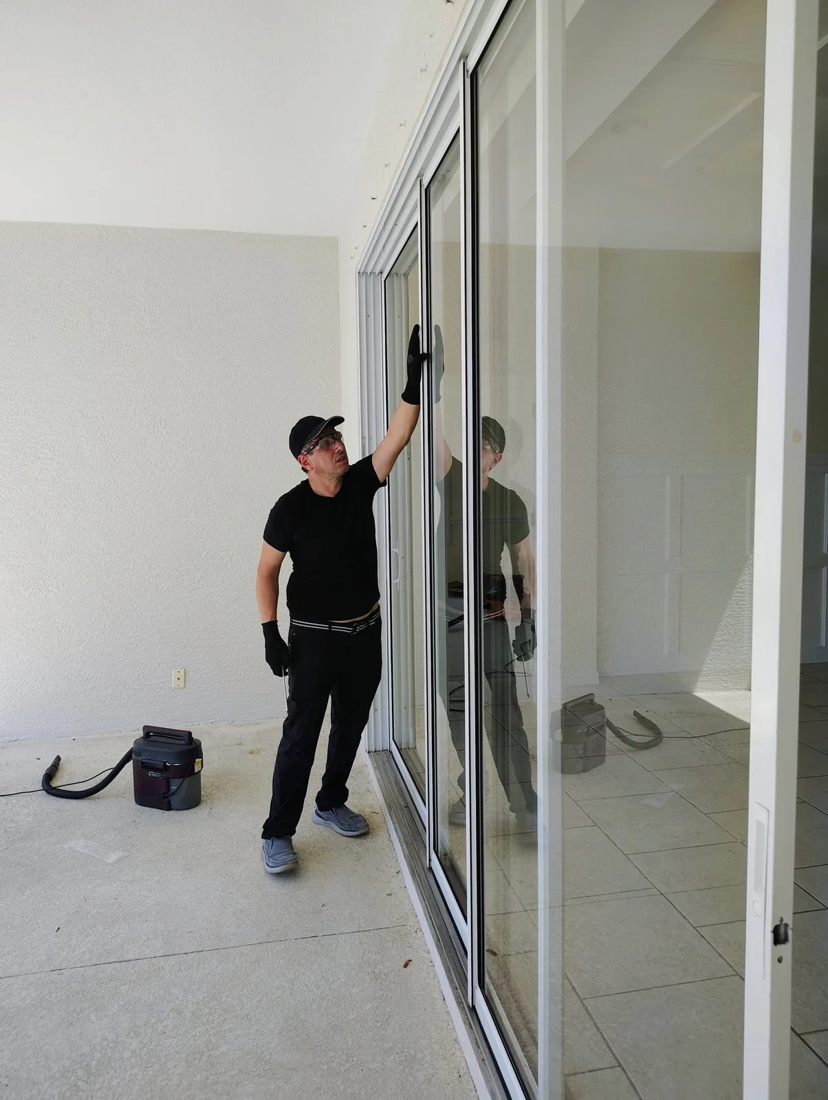 KayGE technician restoring sliding glass door in Florida home